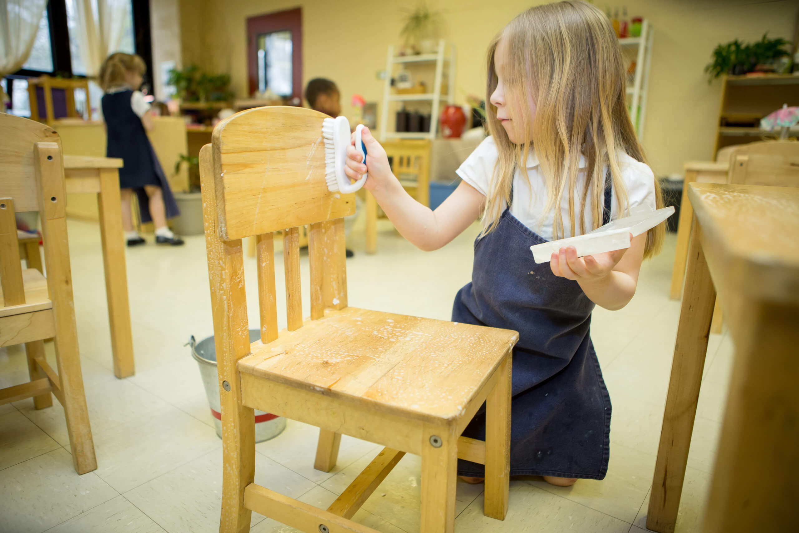 Female student washing a chair