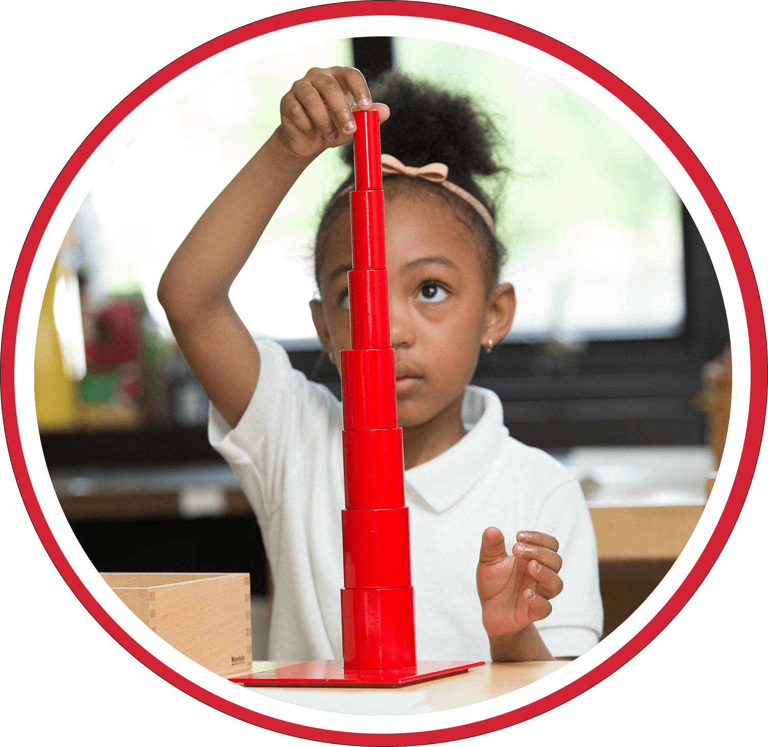 Decorative image of student working with the Pink Tower